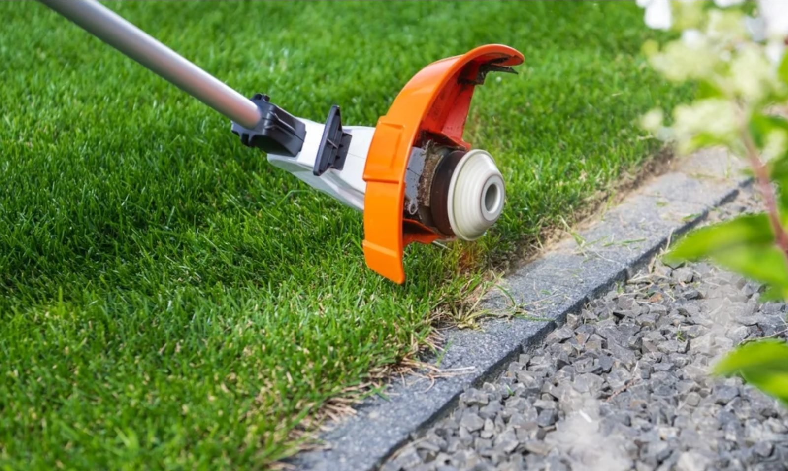 Strimming a clean lawn edge