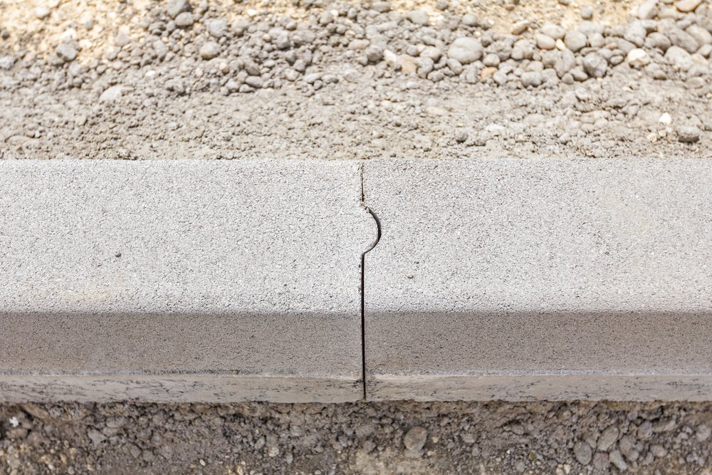 Close,up,view,on,roadside,stones,at,joint,place.